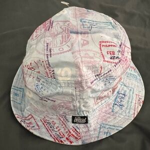 Official brand bucket hat featuring all over passport stamp print New
